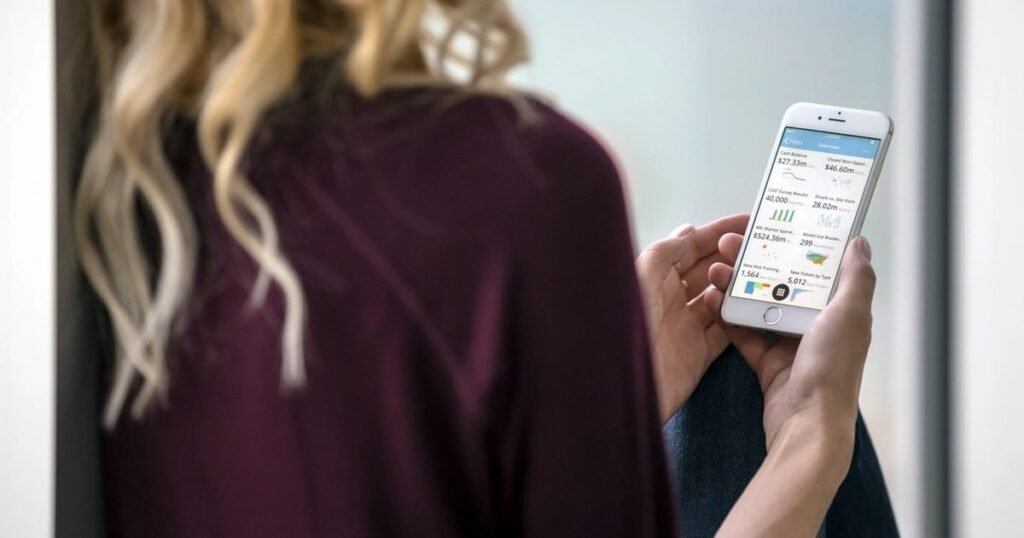 Person using a smartphone while reviewing private information