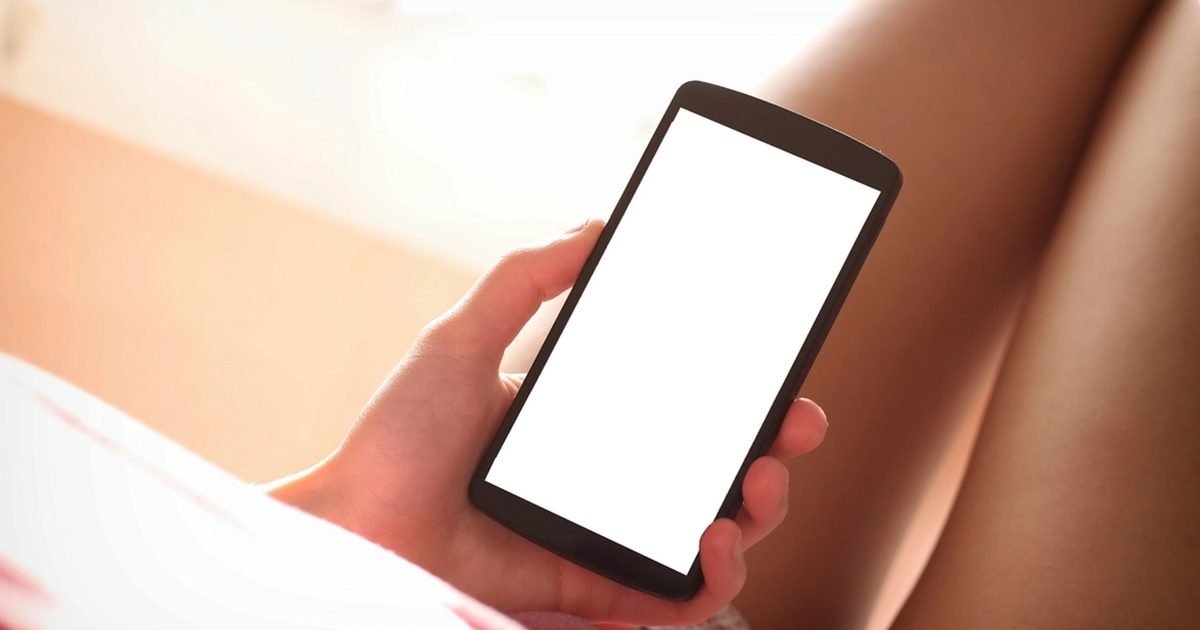 Hand holding a smartphone, representing mobile privacy and account safety