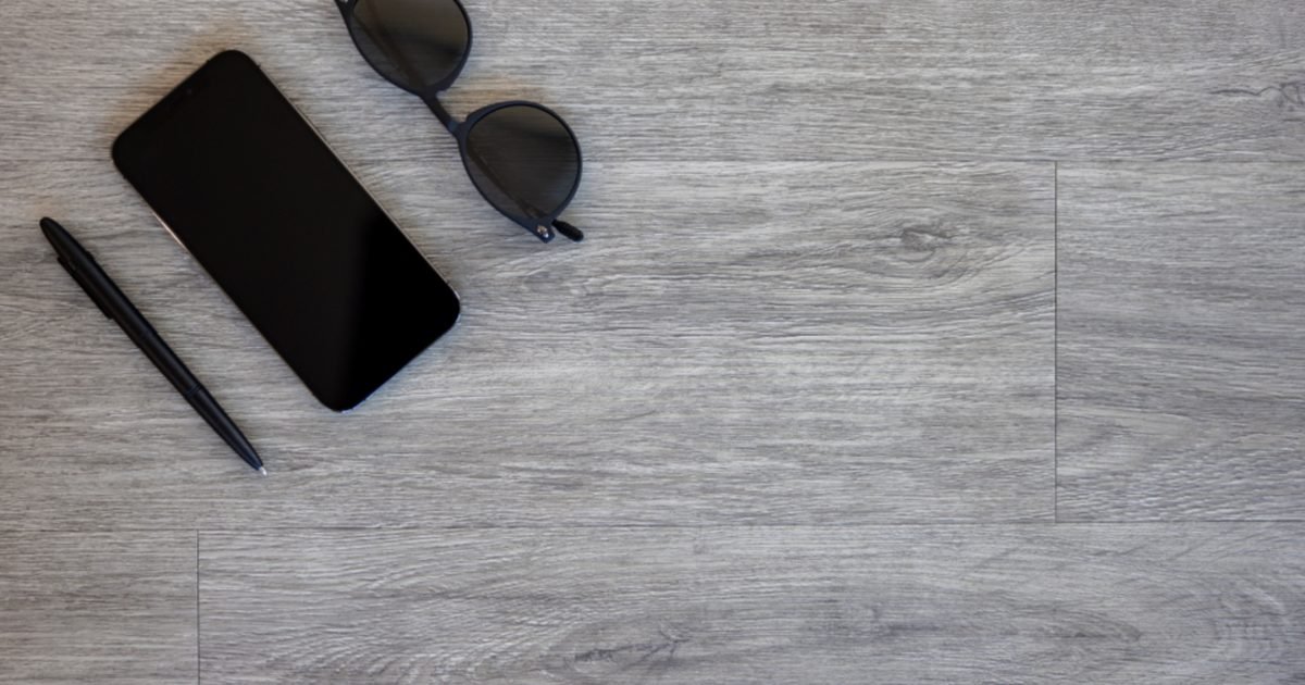 Smartphone on a desk before reviewing app permissions
