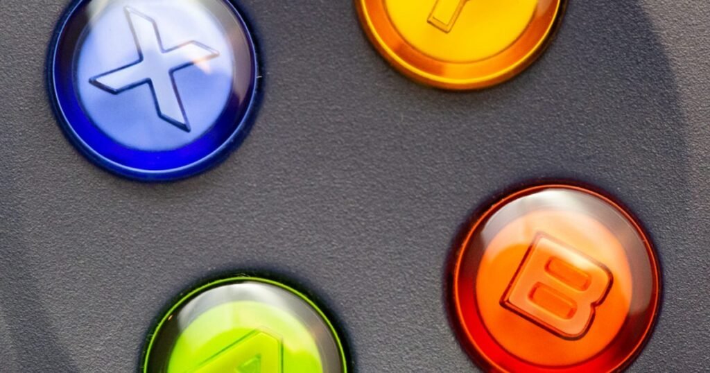 Close-up photograph of colorful game controller buttons for an Android tablet gaming guide