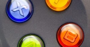 Close-up photograph of colorful game controller buttons for an Android tablet gaming guide