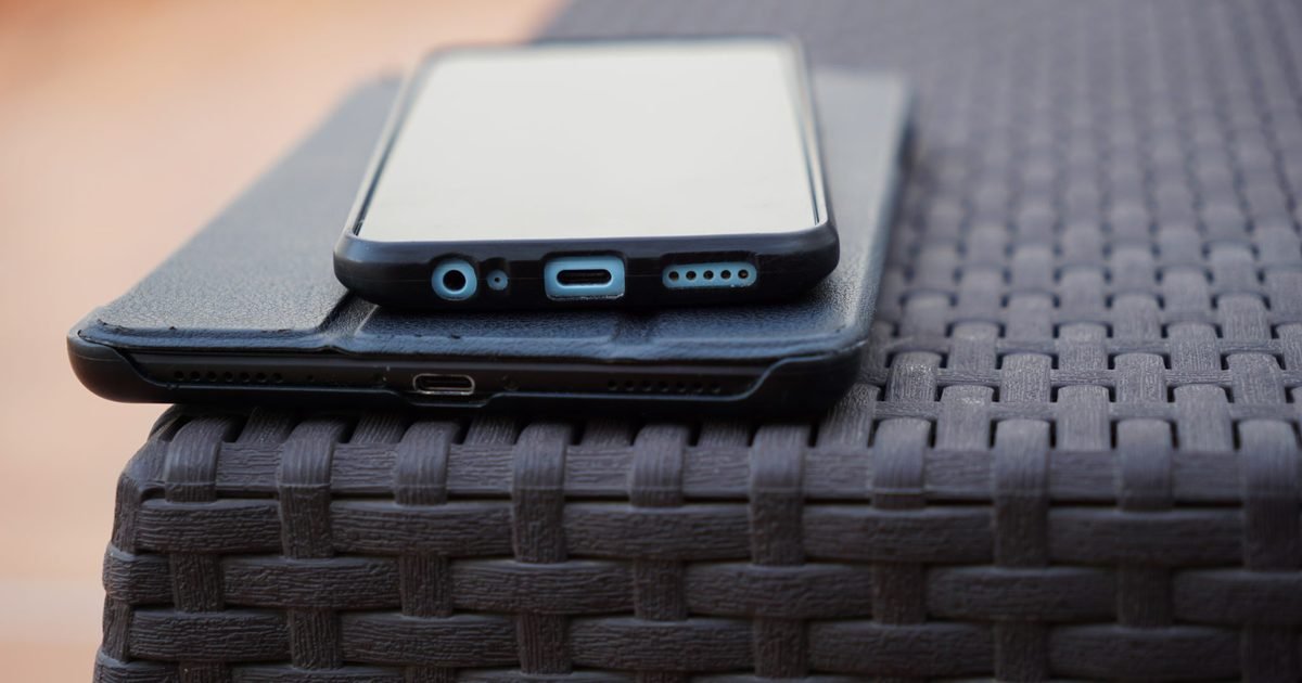 Phone and tablet on a table during a restart and device check